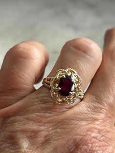 Vintage genuine garnet solitaire ring Size 5 3/4 Fine jewelry Gold plated, pure silver ring, and setting Genuine oval garnet stone measures 8 x 6 mm with a 3 mm depth Basket setting Rope accent, upper shank and setting Gorgeous stone Yellow gold plating 1970 through 1980s ring January birthstone Handset by experience jeweler Star seller shop Over 600 pieces sold on Etsy Fast and free shipping Fine Jewelry Burgundy Garnet Ring, Burgundy Garnet Rings Fine Jewelry, Victorian Ruby Ring With Center Stone, Formal Garnet Burgundy Ring, Formal Burgundy Garnet Ring, Classic Garnet Birthstone Promise Ring, Burgundy Garnet Gemstone Ring, Vintage Garnet Ring With Center Stone, Classic Garnet Birthstone Ring