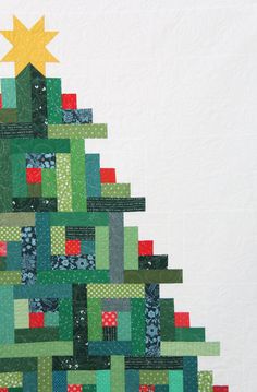 a quilted christmas tree is shown on the wall