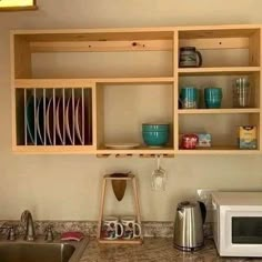 the kitchen counter is clean and ready to be used for dishes, cups, and other things