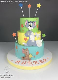 a three tiered cake with an animal on it's side and stars in the background