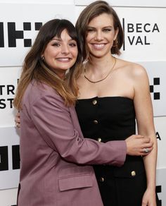 two women hugging each other at an event