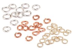 many different types of rings and loops on a white background