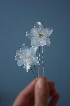 Pearl white floral hairpins with a translucent petals in silver wire frame completely handcrafted by my from the UV resin, silver wire and tinted with pearlescent pigment. In the center of each flower there is a rhinestone in a silver frame. Depending on the lighting these flowers look more translucent or pearly white.  They can be placed in your hair in any quantity depending on your hairstyle. I would recommend using at least two pieces to make the hairstyle look complete. This piece is so del Handmade White Flower Hair Accessories, White Flower-shaped Hair Accessories With Handmade Flowers, White Flower-shaped Hair Accessories As Gift, White Flower Hair Accessories For Gift, White Flower Hair Accessories For Gifts, White Hair Accessories With Flower Decoration As Gift, Translucent Flowers, Hairstyle Look, Your Hairstyle