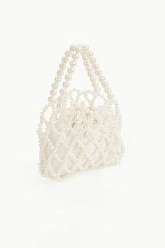 This eye-catching purse with ravishing beauty is the perfect to-go bag to any cocktail parties. It has its unique sparkle and will shine more brightly with you carrying it. Features: Durable inner bag Drawstring closure design Detachable pearl chain attached 9 inch / 20 cm x 7.1 inch / 18 cm ( L x H ) Rectangular Pearl Evening Bag For Parties, White Pearl Evening Bag For Party, Party Embellished Pearl Evening Bag, Pearl Clutch For Party, Chic Pearl Clutch For Party, Pearl White Beaded Evening Bag For Party, Beaded Pearl Evening Bag, Embellished Pearl Bags For Party, Pearl Beaded Evening Bag