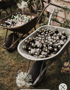 a wheelbarrow filled with lots of beer bottles