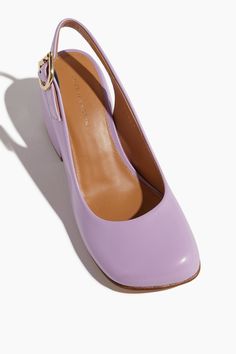 The Dries Van Noten Sling Back Pump in Lilac will add a whimsical touch to your wardrobe. These slingbacks feature a round toe with a chunky block heel in lilac hued patent leather. Slingback heels Round toe Block heel 2.5" inch heel Leather upper Purple Sling Back, Lilac Shoes, Feminine Shoes, Shoe Gallery, Stunning Shoes, Slingback Heels, Fancy Shoes, Chunky Block Heels, Wedding Heels