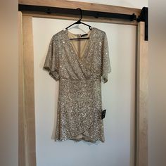 Lulus Sequin Dress, Gold Color. Size Large. Never Worn. Bought It As A Second Dress For The Dance At My Wedding But Felt It Was A Little Short For The Occasion! Holiday Bridesmaid V-neck Dress, Dressy Sequined Mini Dress For Wedding, Gold Mini-length Wedding Dress, Gold Mini Length Wedding Dress, V-neck Mini Dress For Wedding Party Season, V-neck Mini Dress For Wedding Party, Short Sleeve Mini Dress For Wedding Party Season, Fitted Short Sleeve Mini Dress For Bridesmaids, V-neck Dresses For Bridesmaid Party Season