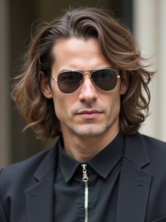 This medium flow haircut with natural waves offers a relaxed yet stylish look perfect for fall. It’s ideal for men who prefer longer hair that moves effortlessly. The natural waves add texture and volume, making it easy to maintain with a bit of light styling product. This cut pairs well with casual and formal outfits, providing a versatile, carefree vibe. Pompadour Fade, Well Groomed Beard, Classic Taper, Viking Braids, Fall Hair Cuts, Low Maintenance Haircut, Long Hair On Top, Natural Wavy Hair, Best Short Haircuts