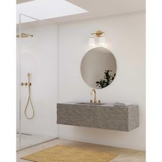 a bathroom with a sink, mirror and shower head in the wall next to it