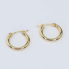 14K gold hoop earrings. 14K yellow gold hoop earrings. The earrings will arrive in a gift box ready for someone special! Dimensions : 15mm diameter To see add-on click on the link below. https://www.etsy.com/shop/SashJewelry?section_id=12359884 To see more children's jewelry click on the link below. http://www.etsy.com/shop/SashJewelry?section_id=12441132 To see more Sash Jewelry items click on the link below. http://www.etsy.com/shop/SashJewelry Please don't hesitate to contact me for custom or Anniversary 14k Yellow Gold Filled Huggie Earrings, Gold Round Huggie Earrings In 14k Gold Filled, 14k Yellow Gold Hoop Earrings With Ear Wire, Gold 14k Small Hoop Huggie Earrings, 14k Gold Round Hoop Earrings For Gift, Gold Plated Round Huggie Earrings With Lever Back, Gold Hoop Earrings Stamped 14k For Gift, Gold Hoop Earrings Stamped 14k As Gift, Yellow Gold Plated Hoop Earrings With Lever Back