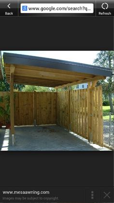 an image of a wooden carport in the yard