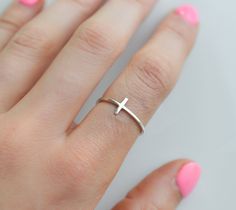 Our sterling silver cross ring is a dainty and elegant purity ring that's perfect for women of faith. Whether worn on your thumb, index finger, or pointer finger, this versatile ring is a simple yet powerful expression of your Christian beliefs. Crafted from high-quality sterling silver, our simple spiritual ring is a timeless accessory that you can wear every day. Rings are sold in sizes 5 6 7 8 9 10  PRODUCT DETAILS * Ring is solid 925 sterling silver, 14k goldfill or 14k rose goldfill * Width Purity Ring Christian Women, Minimalist Sterling Silver Cross Ring, Minimalist Cross Ring For Anniversary, Minimalist Adjustable Cross Ring, Minimalist Silver Cross Rings, Minimalist Cross Rings For Gifts, Purity Ring Christian, Christian Purity Ring, Cross Rings For Women