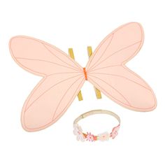 a pink butterfly with two pieces of hair attached to it