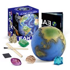 the earth and its contents are shown in front of a box with other items around it