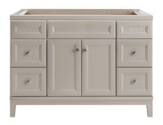 a white bathroom vanity with drawers and a gold sink faucet on the side