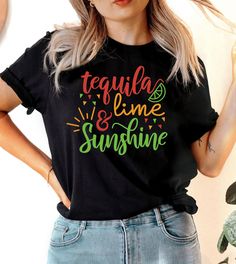 This "Tequila, Lime & Sunshine" design is the perfect, fun Cinco De Mayo shirt for anyone that loves drinks and to celebrate! Fun Graphic Print Tops For Cinco De Mayo, Fun Tops With Funny Print For Cinco De Mayo, Fun Cinco De Mayo Tops With Funny Print, Fun Cinco De Mayo Funny Print Tops, Cinco De Mayo Fun Crew Neck T-shirt, Black Crew Neck T-shirt For Cinco De Mayo, Fun Crew Neck T-shirt For Cinco De Mayo, Ugly Christmas Sweater Couples, Sunshine Design