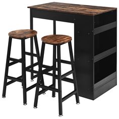 two stools are next to a table with an open bookcase on the top