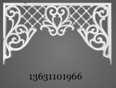 an ornate white iron shelf bracket on a gray background