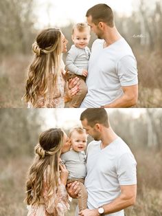 a man and woman holding a baby in their arms while standing next to each other