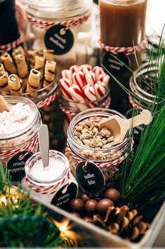 a tray filled with lots of different types of desserts and candies on top of a table