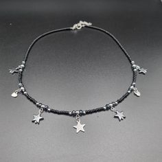 This elegant beaded necklace is made of glass beads in black, dark gray, and gray color, with various star and heart pendants. It can be worn for everyday occasions but is also suitable for special occasions. Necklace is 40 cm long, with a 5 cm extension chain. Handmade Black Star Necklace, Black Star Charm Necklace, Elegant Beaded Necklace, Heart Pendants, Necklace Elegant, Wedding Jewellery Necklace, Wedding Necklace, All Seasons, Croatia