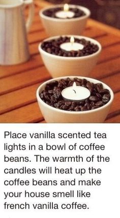 three white bowls filled with coffee beans on top of a wooden table