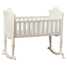 a white baby crib with rocking legs and no mattress on the bottom half, against a white background