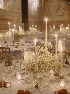 the table is set with candles and flowers