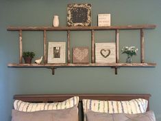 a bed with two wooden shelves above it