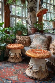 the living room is filled with plants and decorative furniture, including two stools that are made from tree stumps