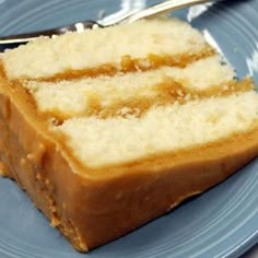 a piece of cake on a blue plate with a fork