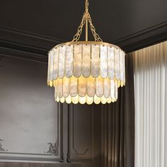 a chandelier hanging from the ceiling in a room