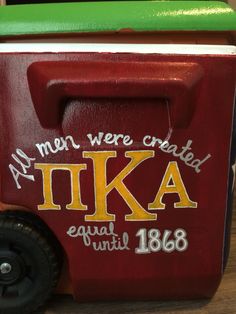 a red cooler with the words, all men were created ikea equal until 1876