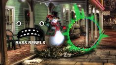 a christmas scene with a snowman in front of a house and the words bass reels on it