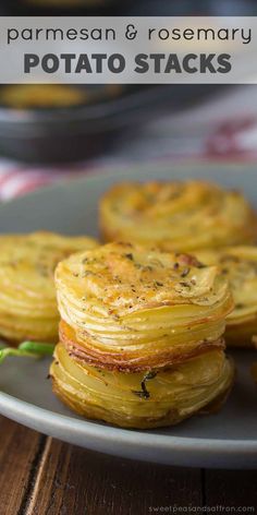 some food is sitting on a plate and ready to be eaten with the words parmesan & rosemary potato stacks real housemoms