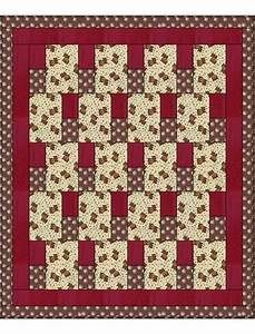 a red and white quilted wall hanging