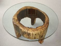 a glass table topped with a wooden object