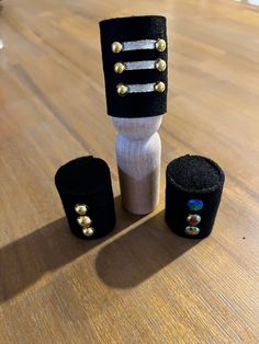 a pair of black and white garters sitting on top of a wooden table