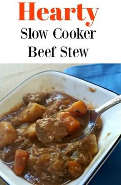 hearty slow cooker beef stew with carrots and potatoes in a white bowl