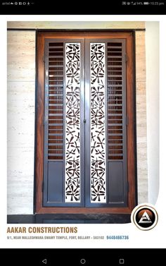 the front door is decorated with an intricate design and decorative glass panels, along with wooden shutters