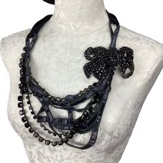 Layered Beaded Ribbon And Stud Chains With Studded Bow On One Side. Long Tie Ribbon Back Vintage Party Beaded Necklaces With Silver Chain, Silver Jewelry With Beaded Chain For Evening, Black Embellished Necklace For Party, Silver Jewelry With Black Beads For Evening, Silver Beaded Necklace With Silver Chain For Party, Silver Embellished Necklace For Gift, Elegant Evening Metal Beaded Necklaces, Elegant Evening Beaded Metal Necklaces, Black Embellished Jewelry For Evening