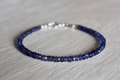 I have made this beautiful bracelet from tiny Iolite beads. The beads are faceted which means they are cut and polished in a way to sparkle, catching the light from all angles.  Iolite is a stunning semi-precious gemstone that is a Lavender to Sapphire blue colour, and is otherwise commonly known as Water Sapphire because of its colour! It is also the birthstone for September. These beautiful Iolite beads measure approximately 4mm by 3mm. It is a delicate bracelet so would be easy to wear either Sterling Silver Stacking Bracelets, Something Blue, Bracelet Stack, Semi Precious Gemstones, Beautiful Bracelet, Delicate Bracelet, Blue Sapphire, Mens Bracelet, Semi Precious