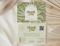 a close up of a thank you card on a bed