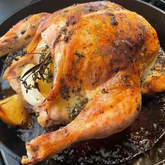 a roasted chicken in a cast iron skillet