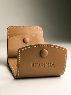 The small front pocket wallet is made of genuine leather the wallet is stitched with thread and made by hand with French stitching. The edges of the women leather wallet are painted and polished. This minimalist wallet make a pretty personalized gift for mom, wife birthday gift, sister birthday gift or gift for her Wallet description: - Italian leather - beige color - 3 card slots - 1 compartment for bills - 1 button compartment for coins - flap on leather buttons - the skin stretches according to your lifestyle - painted and polished edges. - linen, waxed threads - 100% handmade - Dimensions: Overall size: width 4.7 "- 12 cm height 3.93" - 10 cm Please note that due to the fact that each handcrafted wallet is handcrafted from calfskin, sometimes they may have slight differences in color o Brown Leather Lined Trifold Wallet As A Gift, Brown Hand-stitched Card Holder For Gift, Brown Hand-stitched Card Holder Gift, Rectangular Hand-stitched Wallets For Gifts, Hand-stitched Bifold Wallets For Gifting, Hand-stitched Bifold Wallet As Gift, Hand-stitched Bifold Wallets As Gifts, Hand-stitched Rectangular Coin Purse As Gift, Rectangular Hand-stitched Coin Purse As Gift