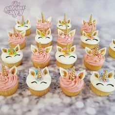 there are many cupcakes with unicorn faces on them