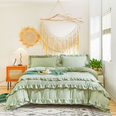 a bed room with a neatly made bed next to a window and a rug on the floor