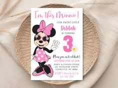 a minnie mouse birthday party with pink and black polka dots on the bottom, including a card that says i'm this minnie our sweet little delidan is turning 3