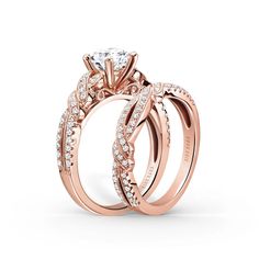 two rose gold wedding rings with diamonds on each band and the center diamond in the middle