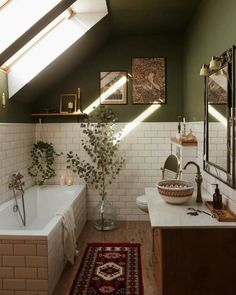 a bath room with a tub a sink and a rug